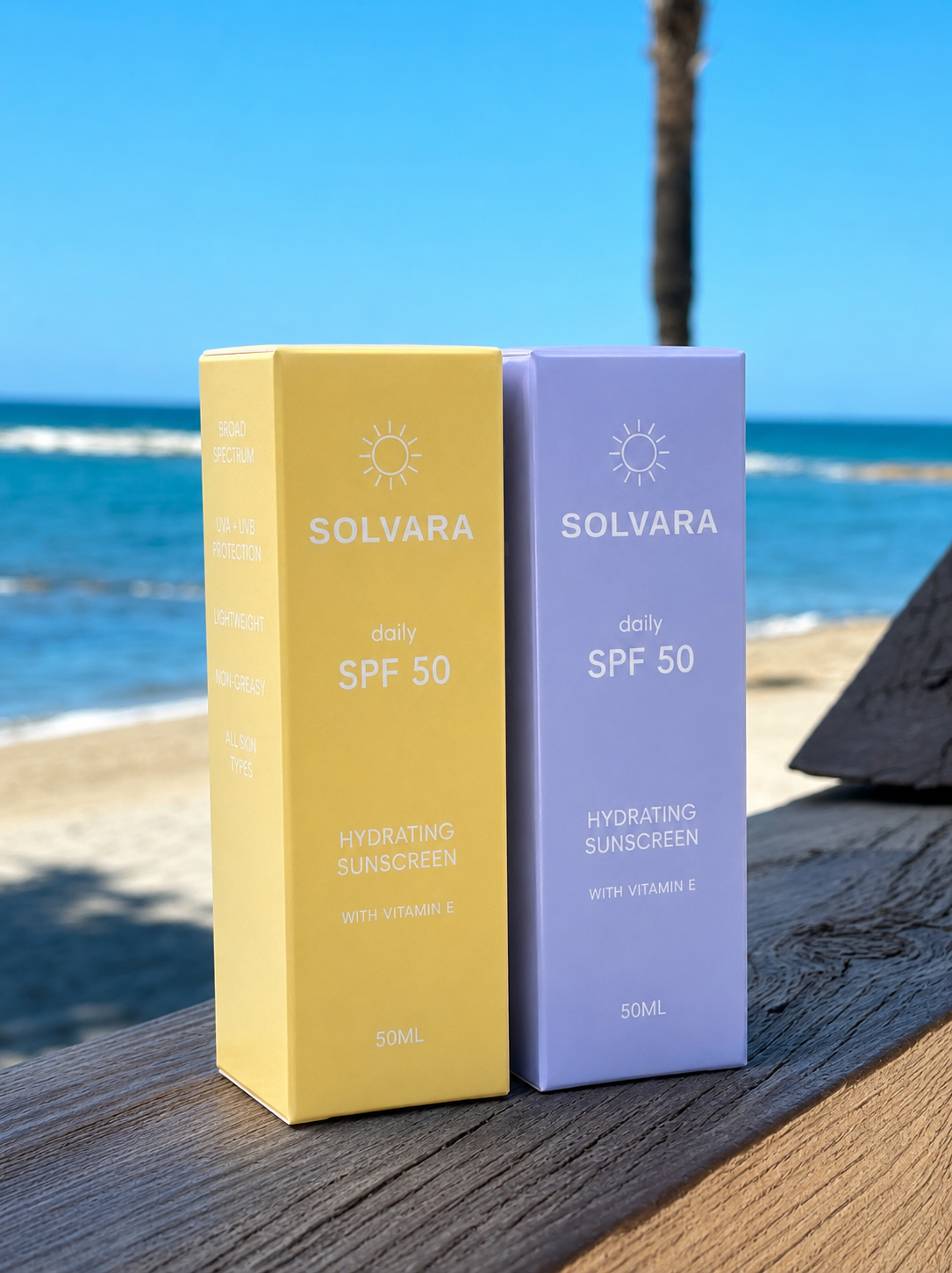Blue and yellow SOLVARA Daily SPF 50 duo beside the Mediterranean Sea